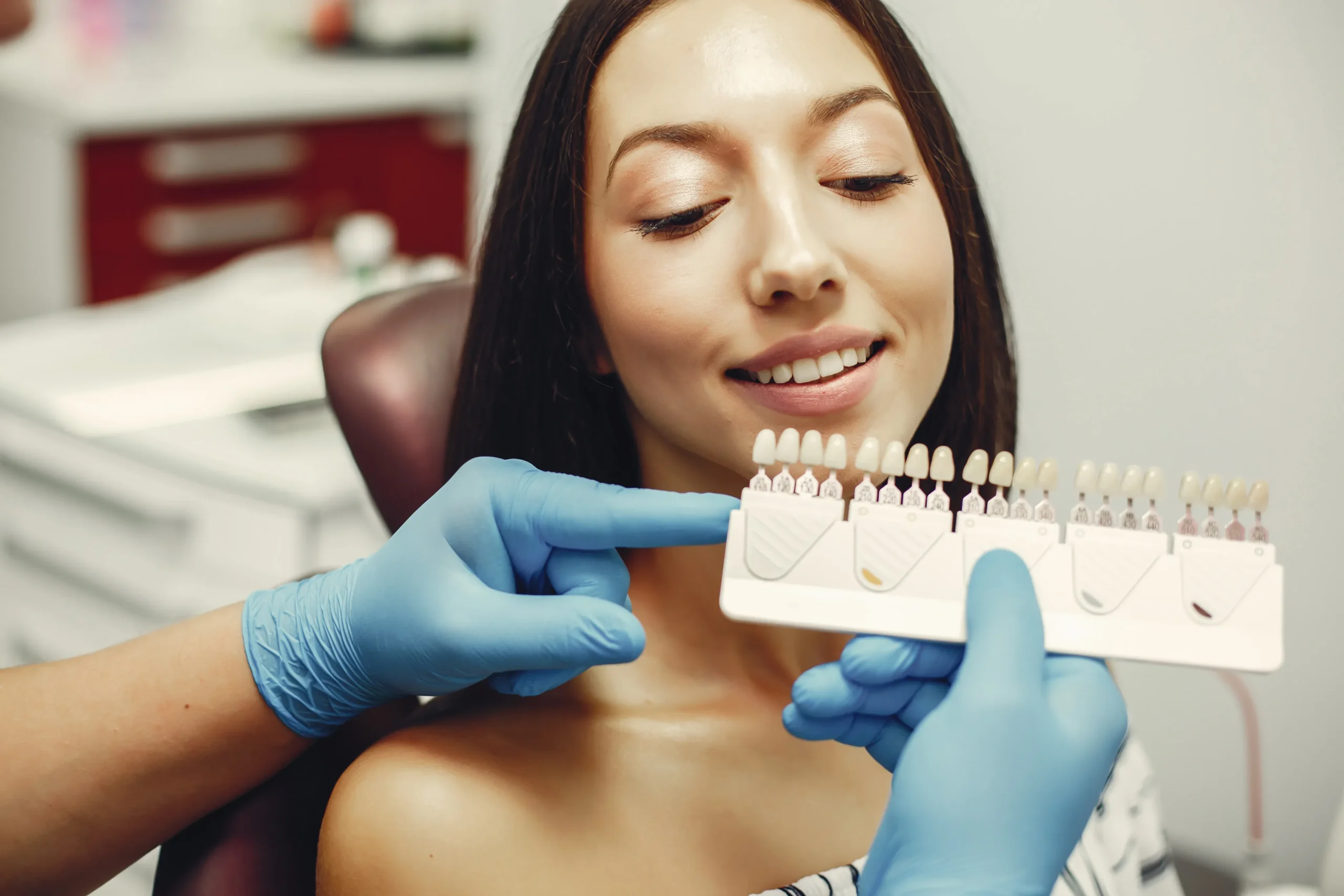 Porcelain Veneers Near You – Patient Choosing Tooth Shade for Natural Smile Makeover